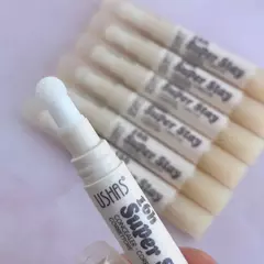 Corrector de ojeras con aplicador ushas