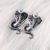 Aretes cobra