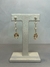 Brinco Insp. Carla Amorim c/ zirc.+zirconias ambar - comprar online