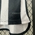 Detalhe da camisa Atlético Mineiro Home 24/25, mostrando a tecnologia AEROREADY no tecido.