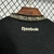 Costa da camisa Botafogo II 24/25 na cor preta, destacando o logo da Reebok e o detalhe do colarinho.