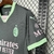 Camisa de torcedor masculina do Milan III 24/25, na cor verde com detalhes em rosa, exibindo o logo do clube e patrocinadores.