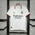 Camisa branca do Milan 2 24/25 para torcedores masculinos, com detalhes em vermelho e logotipo da Puma.