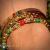 Imagen de Set 3 pzas. Pulsera y brazaletes tema jaguar con zirconias, baño de oro 18k. (rojo/verde/dorado)