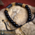 Pulsera cabezas de jaguar con zirconias y piedra ojo de tigre y baño de oro de 18k (negro/dorado) - (copia) on internet