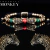 Pulsera cabezas de jaguar con zirconias y baño de oro de 18k (rojo/verde/dorado)