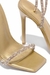 Imagem de uma sandália feminina de salto alto, com detalhes em strass e acabamento dourado.