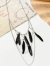 Collar pluma
