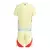 Kit infantil da Seleção Espanha II 24/25 da Adidas, na cor amarela, com detalhes em vermelho.