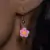 Brincos de flor rosa