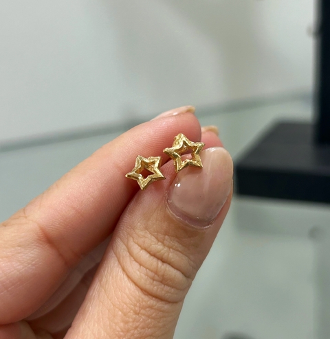 Abridor estrella dorada bañado en oro