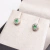 Brinco Esmeralda redondo, Ouro18k com brilhantes.