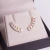 Brinco Earcuff, ouro 18k, navete e brilhantes.