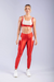 CALÇA LEGGING COM RECORTE DIAGONAL (VERMELHO COM DETALHES NUDE) na internet