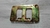 SUPORTE DE PLACA TRASEIRA OPALA 80 - 85 BICROMATIZADO ORIGINAL GM
