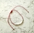 Pulsera Roja con detalles en acero con baño de plata