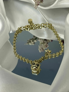 Pulsera con dijes de Búho y estrellita.