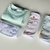 CONJUNTO VERDE AGUA - BODY MANGA CORTA Y SET DE 3 BABTIAS - Giovi’s