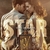 Imagem do perfume UDV Star Ulric de Varens, com um casal em close e a embalagem do produto em destaque.