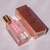 Frasco de perfume Brand Collection 340 de 30ml, com embalagem rosa e detalhes em dourado.
