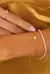 PULSEIRA COM CORAÇAO PASSANTE NO OURO - comprar online