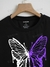 Camiseta crop con estampado de mariposa viene un poco ampliada (color negro) - comprar en línea