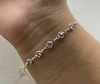 Pulseira de Prata Corações em Zircônia Rosa.