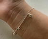 Pulseira de Prata Cinco Zirônias Azul bebê.