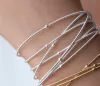 PULSEIRA BANHO DE PRATA CORDA DE VIOLÃO COM ESFERAS