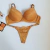 Conjunto de lingerie Rubi fio duplo na cor dourado, com detalhes em renda e alças reguláveis.