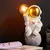 Abajur Elétrico Astronauta Sentado na Lua - comprar online