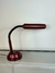 luminária articulada vermelha na internet