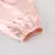 Vestido feminino de seda rosa, com mangas bufantes e botões na frente. - loja online