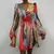 Vestido feminino de seda rosa, com mangas bufantes e botões na frente. - loja online