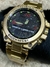 Resist Steel - Dourado com Fundo Preto e Detalhes Vermelho