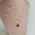 Colar trevo vermelho