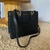 Bolsa preta Miss Dong