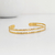 BRACELETE VAZADO DOURADO - PU00431 na internet