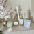 Kit completo da linha Vibrando Amor, da coleção quartzos energéticos, de quartzo rosa com aroma de flor de cerejeira, contendo velas e aromatizadores de ambientes.