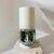 Vela Santuário de Nossa Senhora decorada com cristais de quartzo verdes e uma imagem da santa em destaque.
