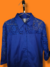 Camisa de mangas 3/4 na cor azul Royal/Bic tamanho G, com apliques de renda na mesma cor na região dos ombros e mangas - comprar online