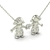 Colar de ouro 18k com pingentes em forma de meninas segurando um coração, adornados com diamantes.