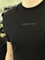 Camiseta Calvin Klein Lettering Central Black - comprar online