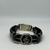 PULSEIRA PRETA DE COURO AJUSTÁVEL ENGATE RAPIDO (CLAVE DE SOL)