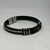 PULSEIRA PRETA DE SILICONE FIO DE ACO na internet