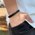 PULSEIRA DE COURO PRETO NÃO AJUSTÁVEL 1 TRANÇADO