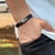 PULSEIRA DE COURO PRETO NÃO AJUSTÁVEL 1 TIRA LISA (PAUS CROMADO)