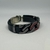 PULSEIRA DE COURO AJUSTÁVEL ENGATE RAPIDO PRETO (CORRENTE COM DETALHE VERMELHO) - comprar online
