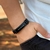 PULSEIRA DE COURO PRETO AJUSTÁVEL (ABENÇOADO BRANCO)