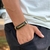 PULSEIRA DE COURO PRETO AJUSTÁVEL (PAI NOSSO DOURADO)